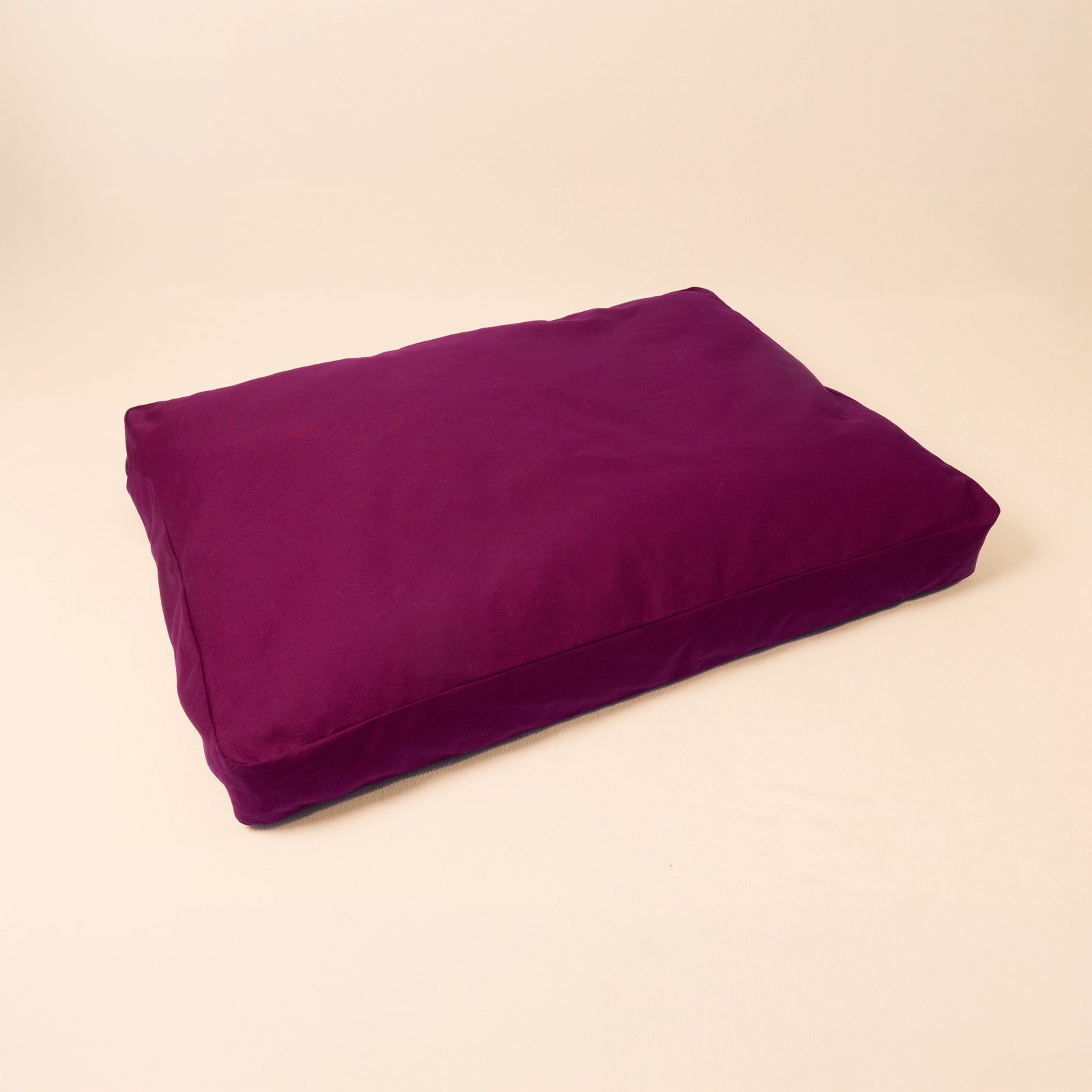Natural wool dog bed in Elderberry color with organic cotton canvas cover and latex filling