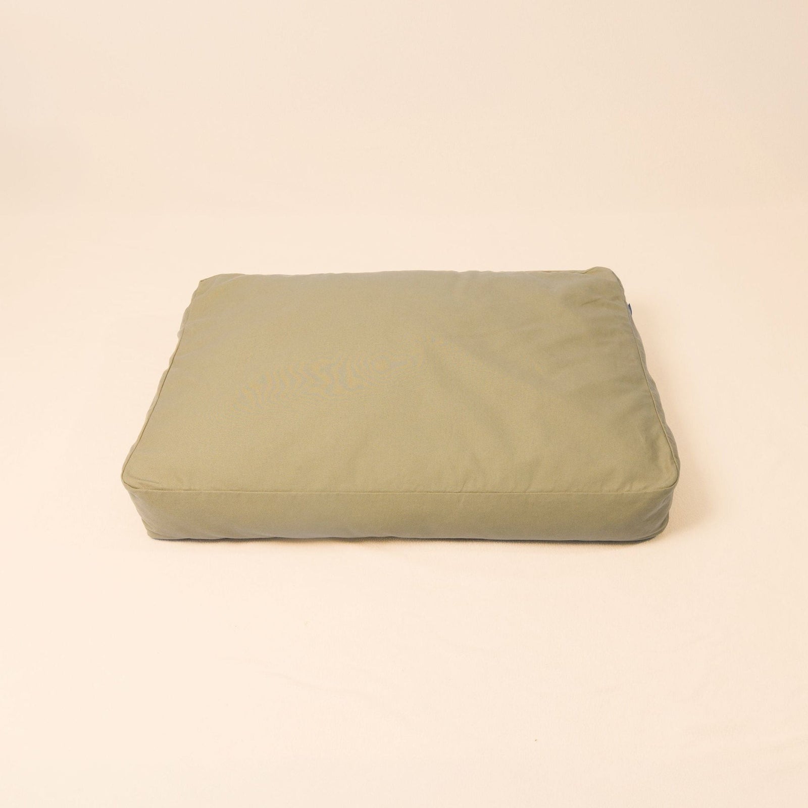 Natural wool dog bed in Moss color with organic cotton canvas cover and latex filling