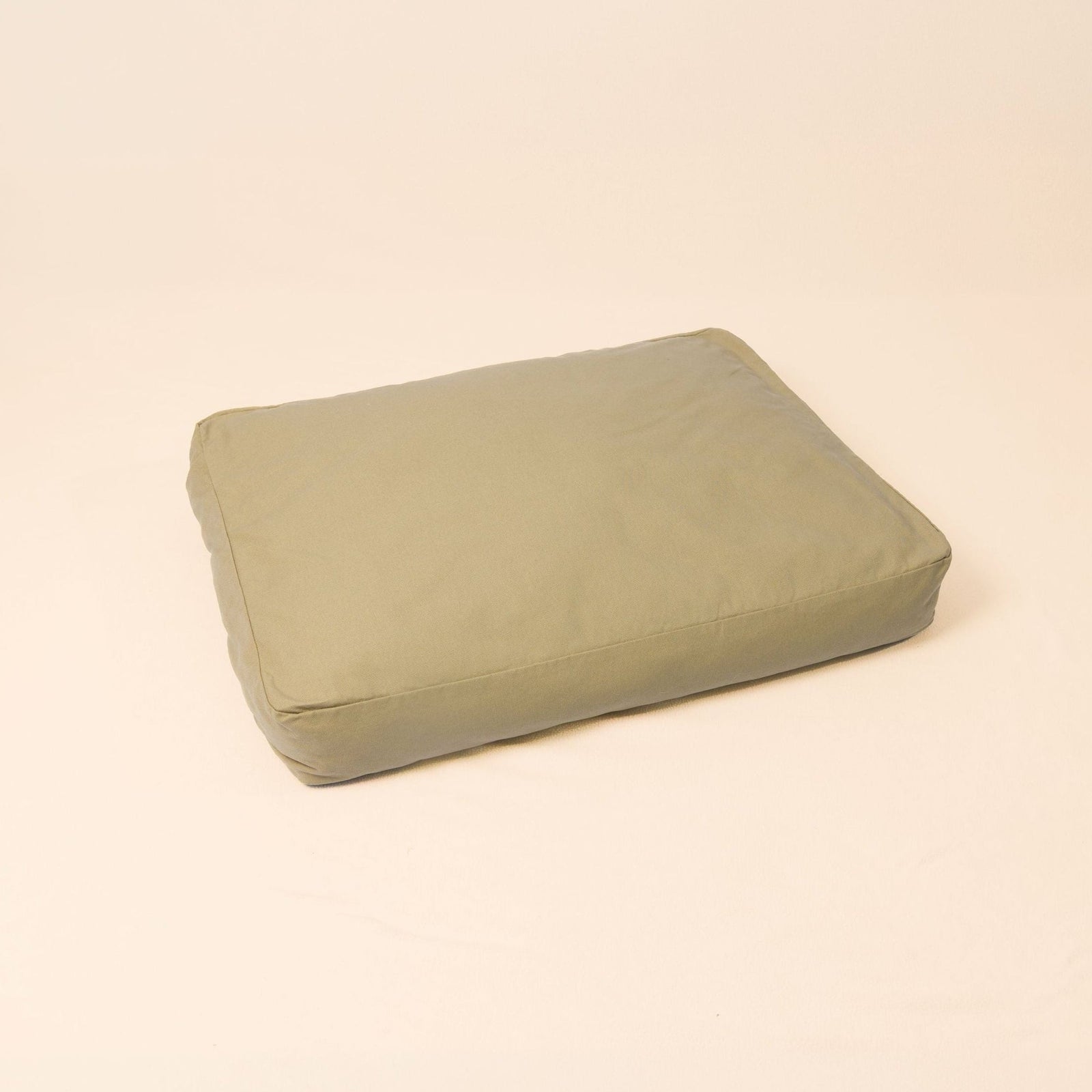Natural wool dog bed in Moss color with organic cotton canvas cover and latex filling