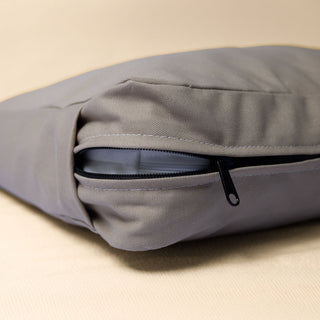 A close-up of The Classic Bed in Driftwood color showing zipper and stitching details.