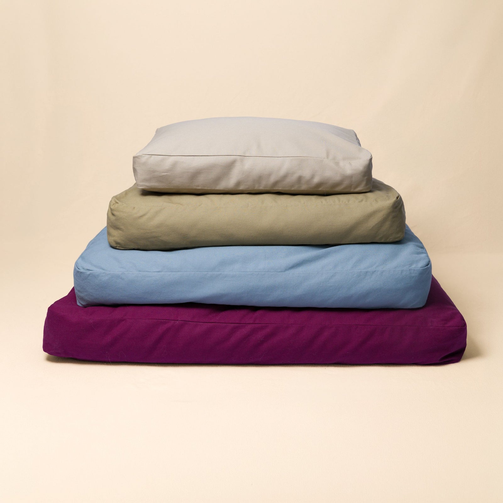 Small, medium, large, and extra large Classic Beds stacked together to compare sizes.