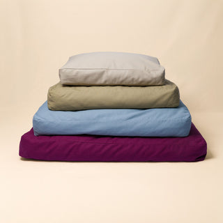Small, medium, large, and extra large Classic Beds stacked together to compare sizes.