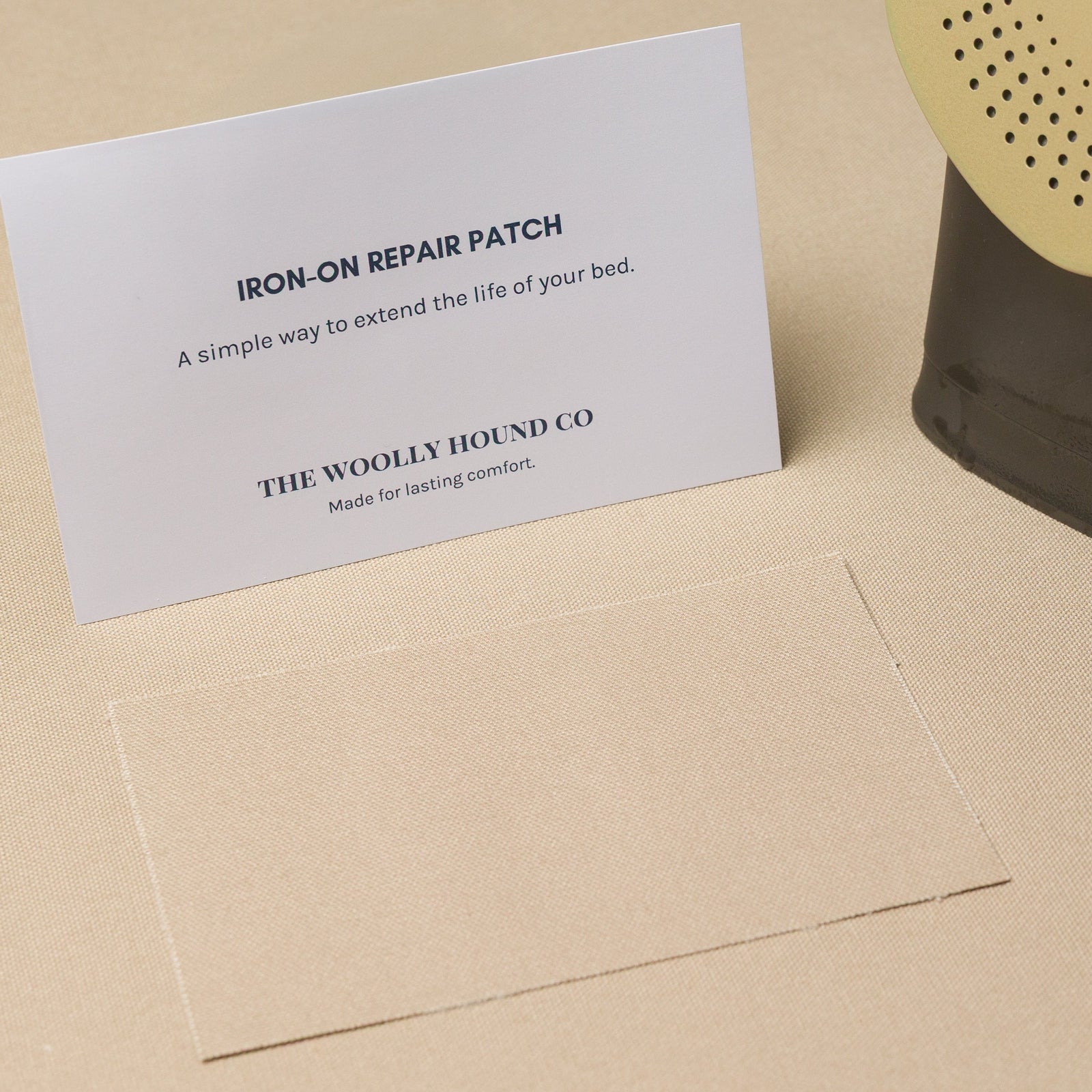 Iron-on bed repair patch kit with patch and instruction card.
