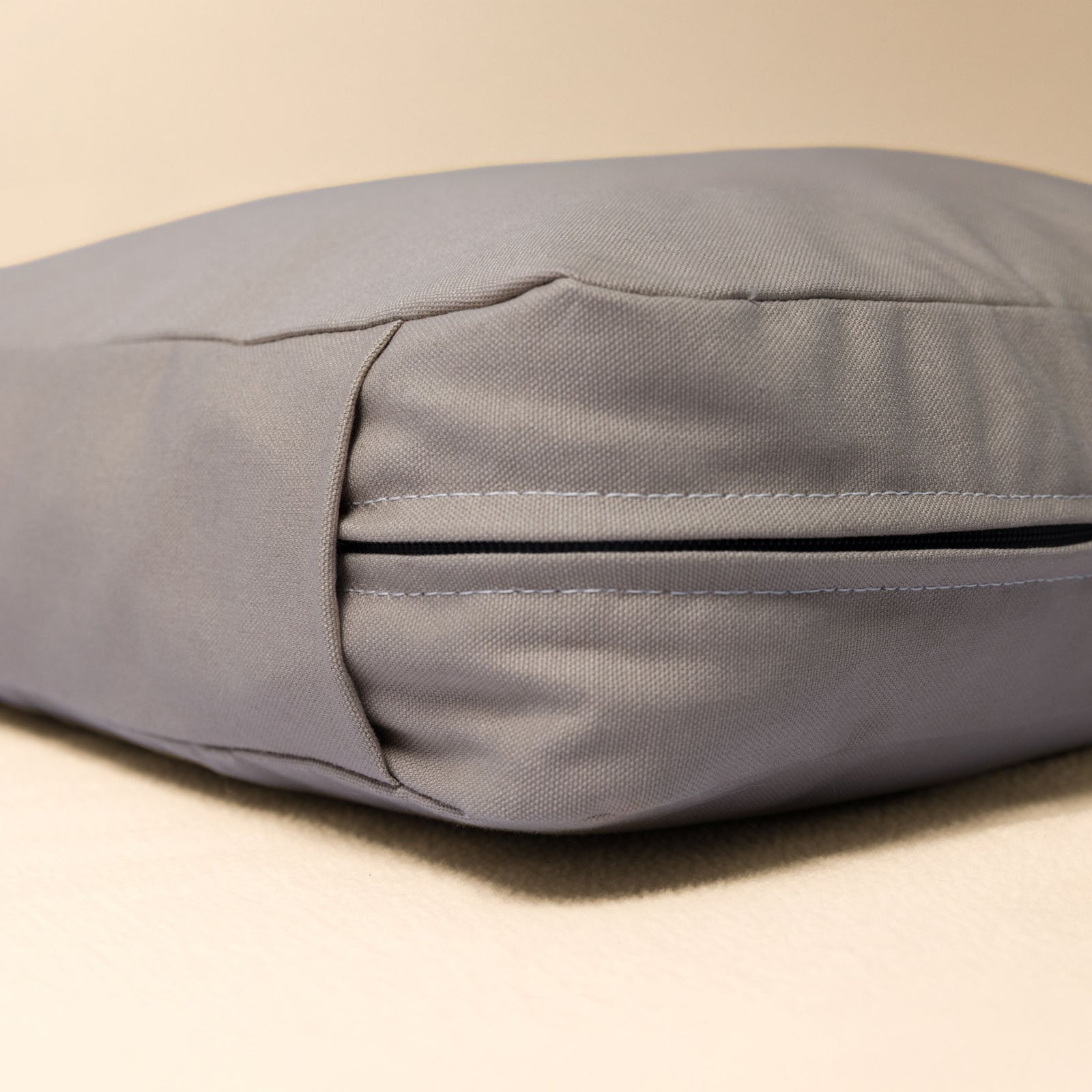 Close-up of the organic cotton canvas fabric and hidden zipper detail used on The Woolly Hound Classic Bed.