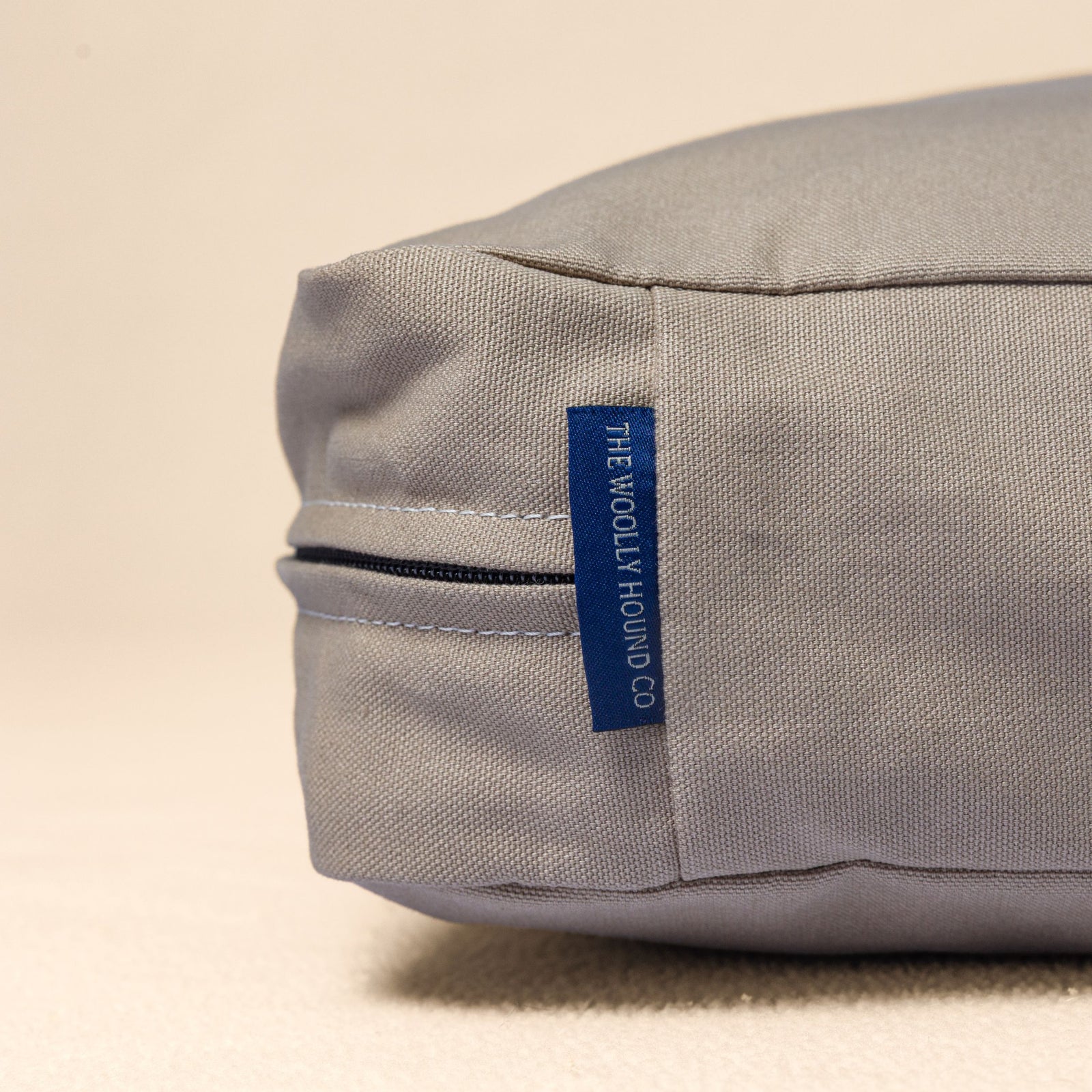 Close-up of the organic cotton canvas and label used on The Woolly Hound Classic Bed