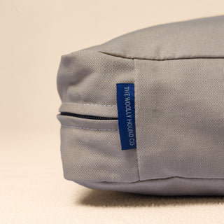 Close-up of the organic cotton canvas and label used on The Woolly Hound Classic Bed