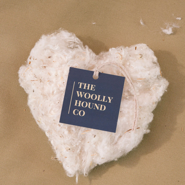 Cotton heart with The Woolly Hound tag displayed on the Driftwood organic cotton canvas cover.