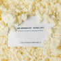 Close-up of natural shredded latex used to refresh The Woolly Hound bed insert with instruction card.