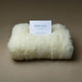 Wool Bed Refresh Kit with natural wool batting and instruction card.