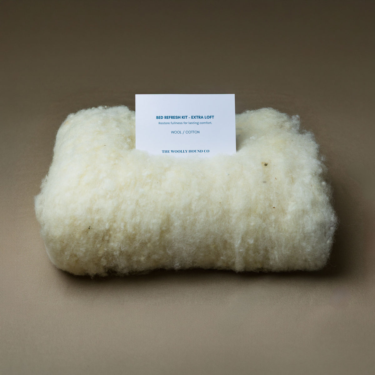 Wool Bed Refresh Kit with natural wool batting and instruction card.